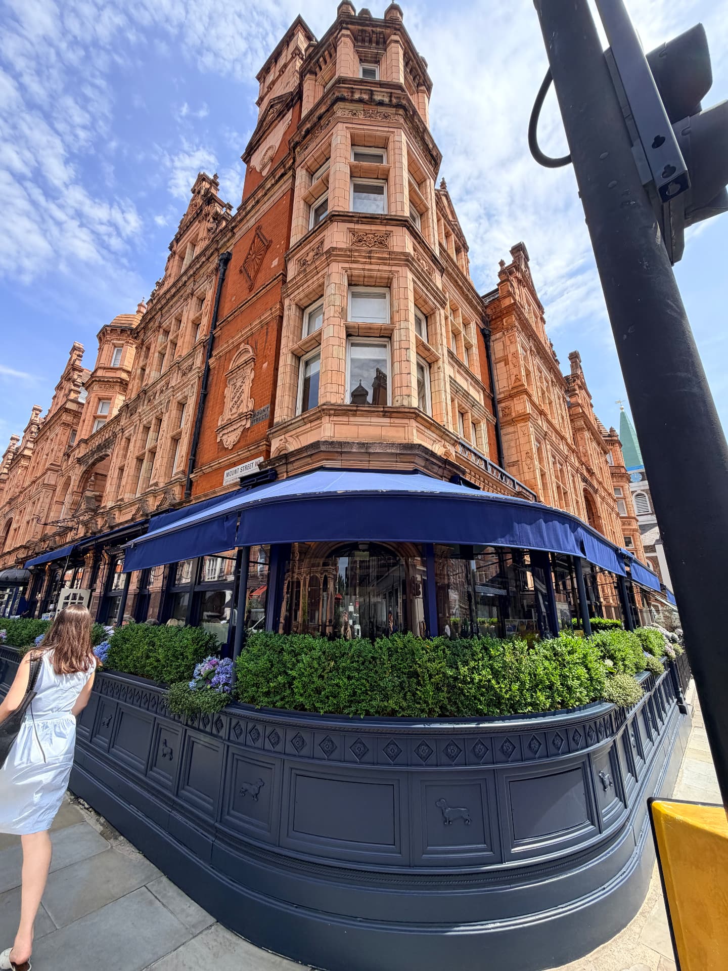 Scott's at the corner of North Audley Street and Mount Street, a passer-by walking around the corner