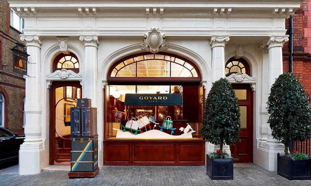 The Goyard shopfront on Mount Street with trunks stacked beside the door
